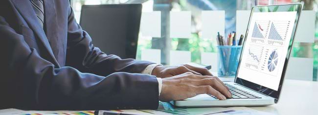 Image of a man in suit creating graphs on a laptop, cybersecurity, password